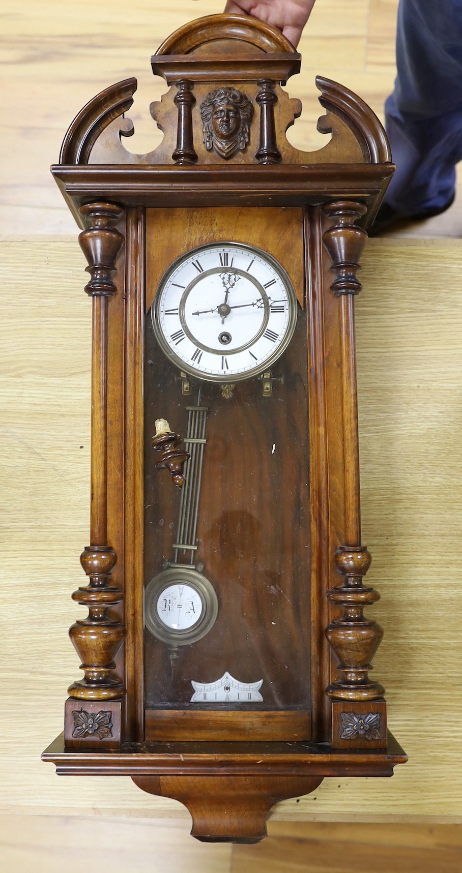 A 19th century German walnut wall timepiece, 89 cms high